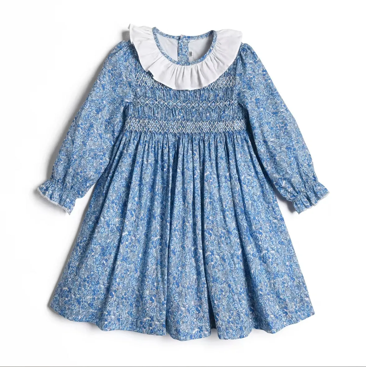 Smocked Girl's blue floral long sleeved dress